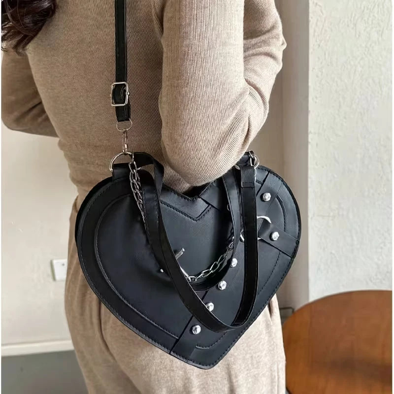 Heart shaped gothic/punk bag with metal studs and cross accessory