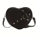 Heart shaped shoulder bag with metal studs
