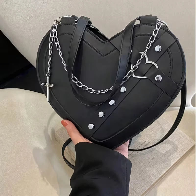 Heart shaped gothic/punk bag with metal studs and cross accessory